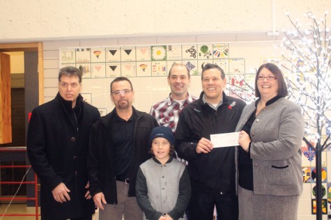 School District 57 vice-chairperson Brenda Hooker, right, accepts a cheque for $10,000 from Canadian Institute of Mining, Metallurgy and Petroleum North-central B.C. chair Jerome LaMarre on Monday morning at CNC. The cheque for for a bursary fund at the Career and Technical Centre, a joing project of the school district and CNC. Also on hand were CNC dean of traces and technology Frank Rossi, left, CIM treasurer Trent Bilodeau, CTC co-ordinator Doug Borden and Navann LaMarre. Allan WISHART/Free Press