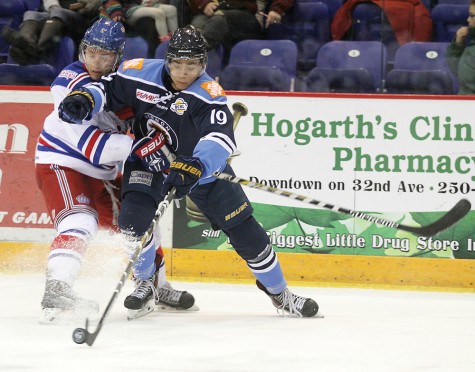 Thomas Aldworth of the Vernon Vipers and Viktor Dombrovskiy of the Prince George Spruce Kings collide as the battle over a loose puck Friday night at Kal Tire Place. Lisa VANDERVELDE/Black Press