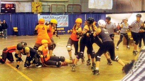 It was a hard-hitting affair between the Rated PG North Stars in orange and the Tournament City Derby Dolls from Kamloops during the Northern Exposure tournament at the Roll-a-Dome on the weekend. Tournament City won this match and downed Saskatoon for the title. Allan WISHART/Free Press