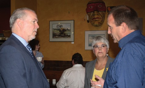 NDP leader John Horgan and NDP MLA Carole James talk with B.C. Wildlife Federation representative Jim Gaicar at Books and Co. Thursday morning. Horgan and James are touring ridings without NDP representation. Bill PHILLIPS/Free Press
