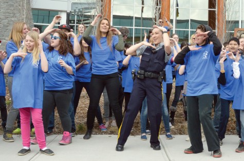 Const. Sonia Blom joins local students in a flash mob outside the Prince George RCMP Detachment on Monday morning. Courtesy Prince George RCMP