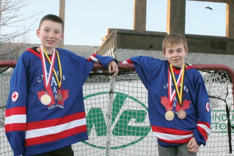 Prince George Peewee hockey players Jacob Ross, left, and Nicolas Braaten show off the medals they won in Europe as members of the Canadian Explorers. Allan WISHART/Free Press