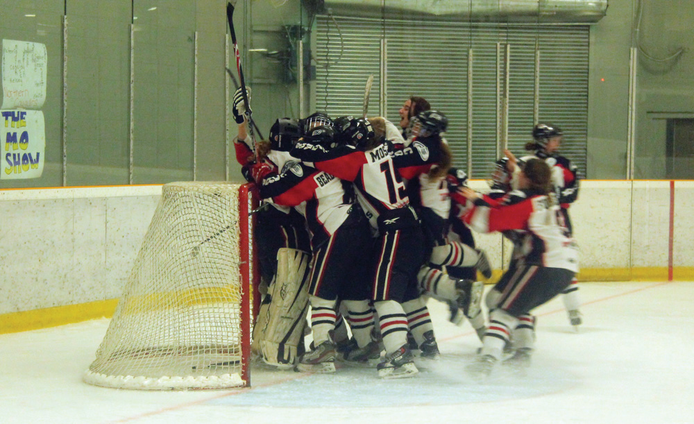 Somehwere in that group of Northern Cougars is goalie Kelsey Roberts, who backstopped them to a 1-0 win over the Fraser Valley Phantoms on Sunday afternoon at Kin 2. The win gave the Cougars the B.C. Female Midget League title, as they downed the Phantoms two games to one in the final series. The Phantoms won game one 2-1 in double overtime before the Cougars tied the series with a 1-0 win in triple overtime. Allan WISHART/Free Press