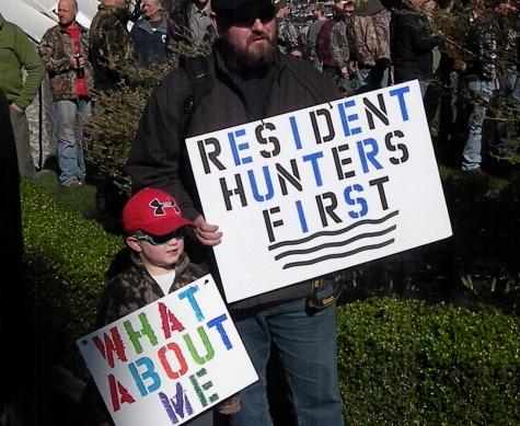 Greg Rensmaag and his son Connor travelled from Maple Ridge to Victoria to join a hunter rally at the B.C. legislature Monday March 2, 2015.